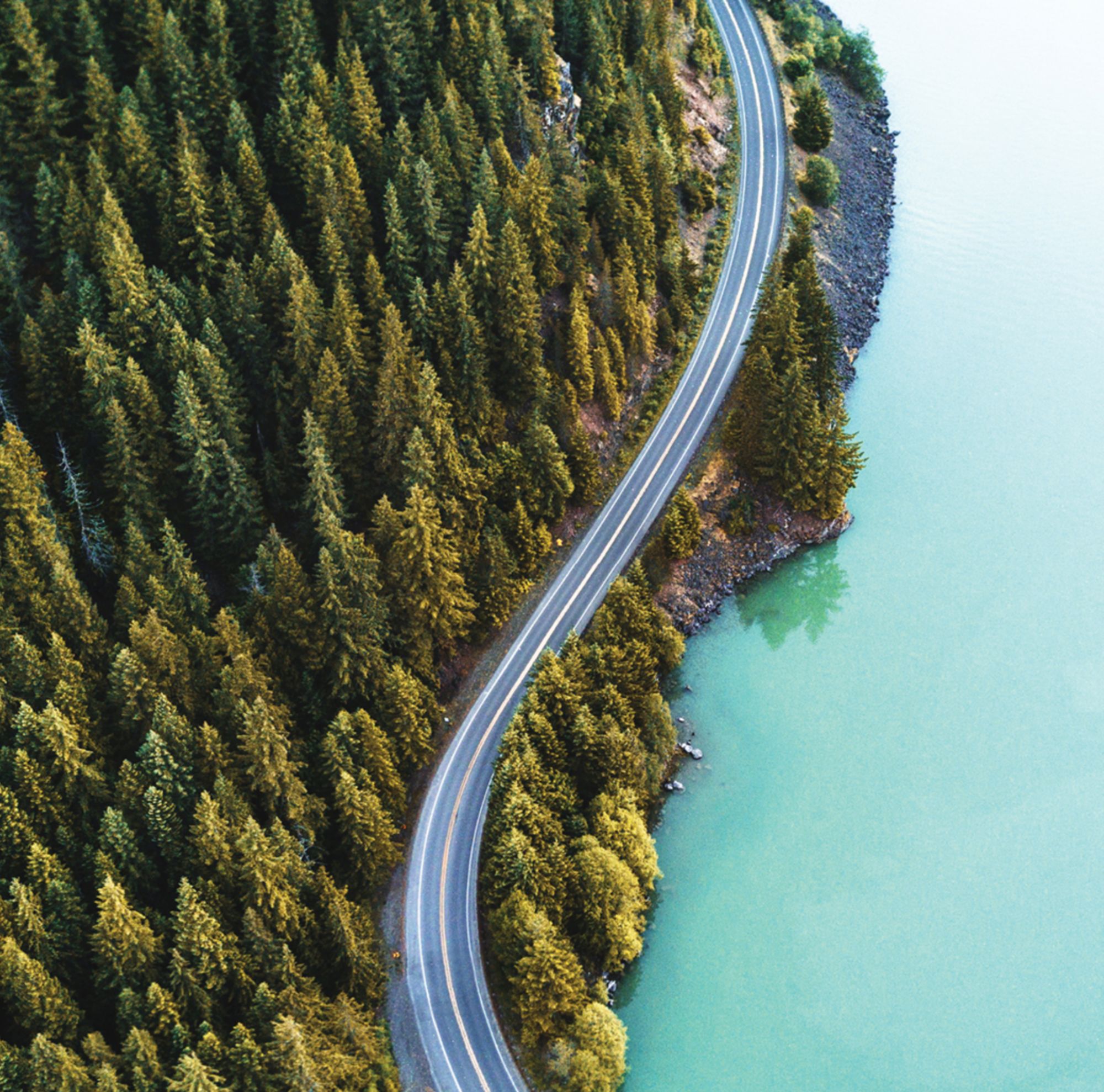 car driving down road 